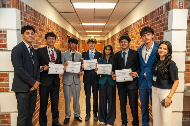 An American Heritage delegation with their awards