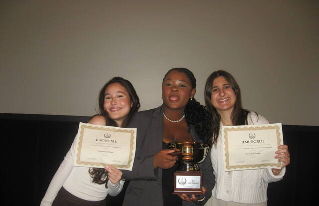 Award-winning delegates with their trophies at ILMUNC