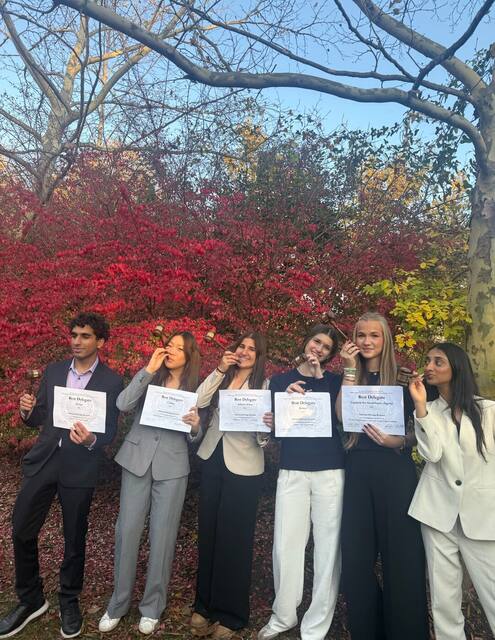 Delegates celebrating their awards at WHSMUN