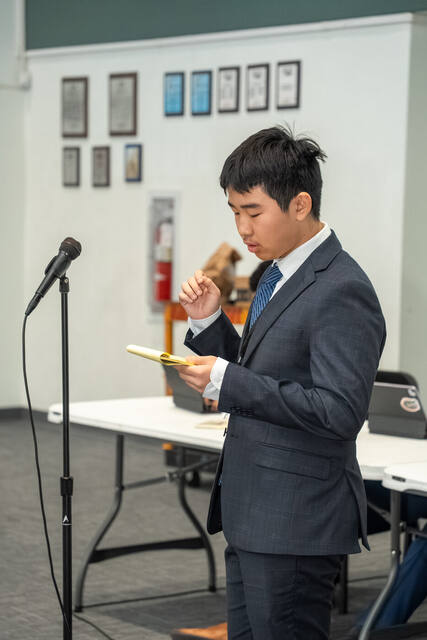A delegate delivering a speech at the podium